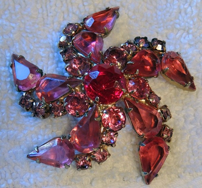 Brooch with red stones, photo