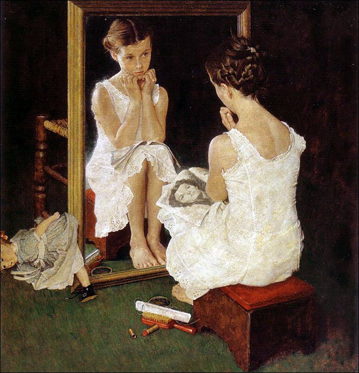 girl with a magazine near the mirror