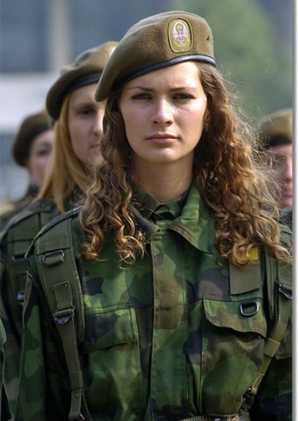 Girl in military uniform serving in the army