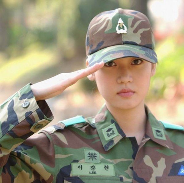 Girl in military uniform serving in the army