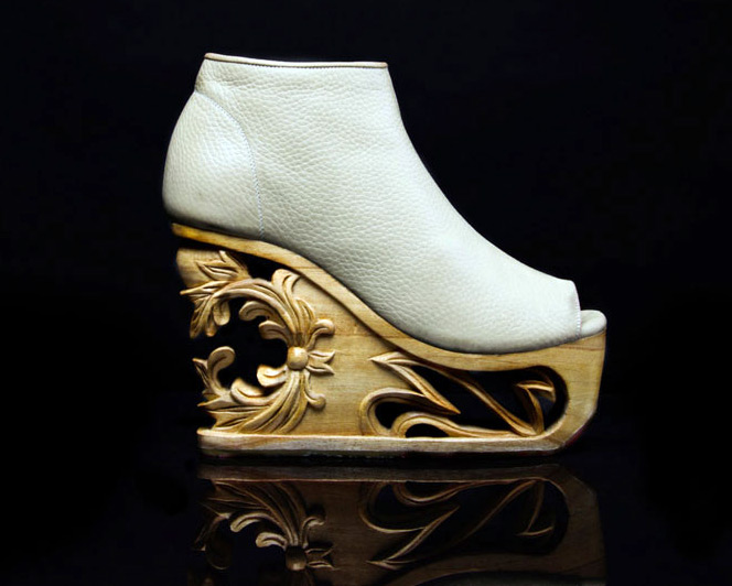 Shoes on a wooden carved wedge