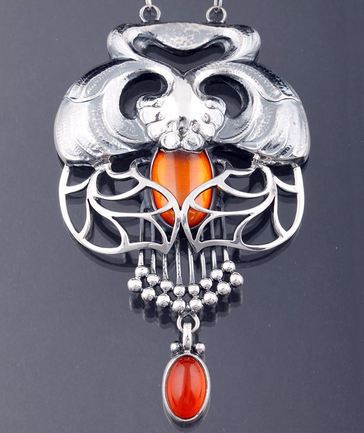 Silver pendant with amber