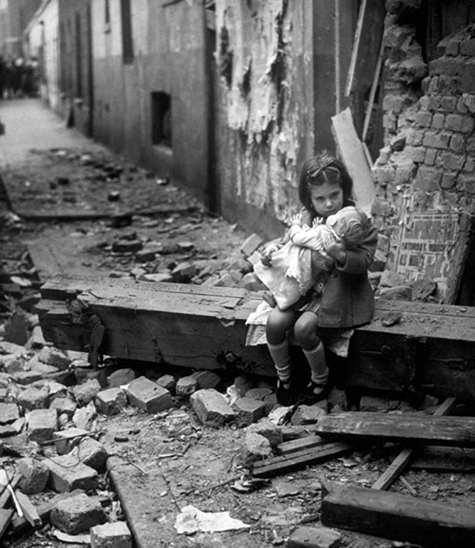 Girl playing with a doll - vintage photo