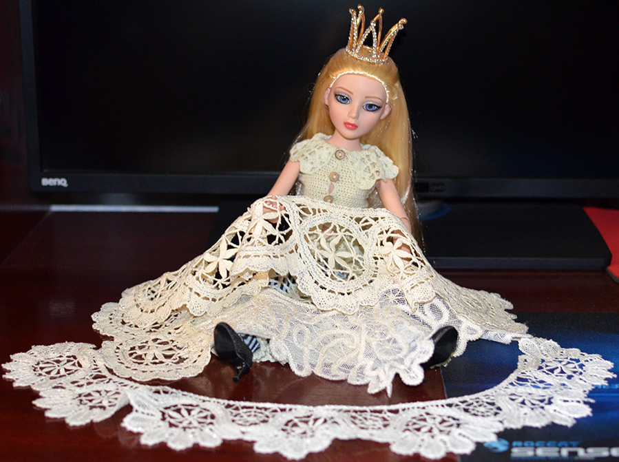 Doll with handmade lace