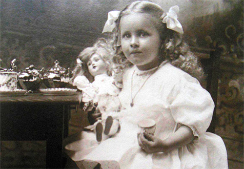 Girls with their favorite dolls in antique photos