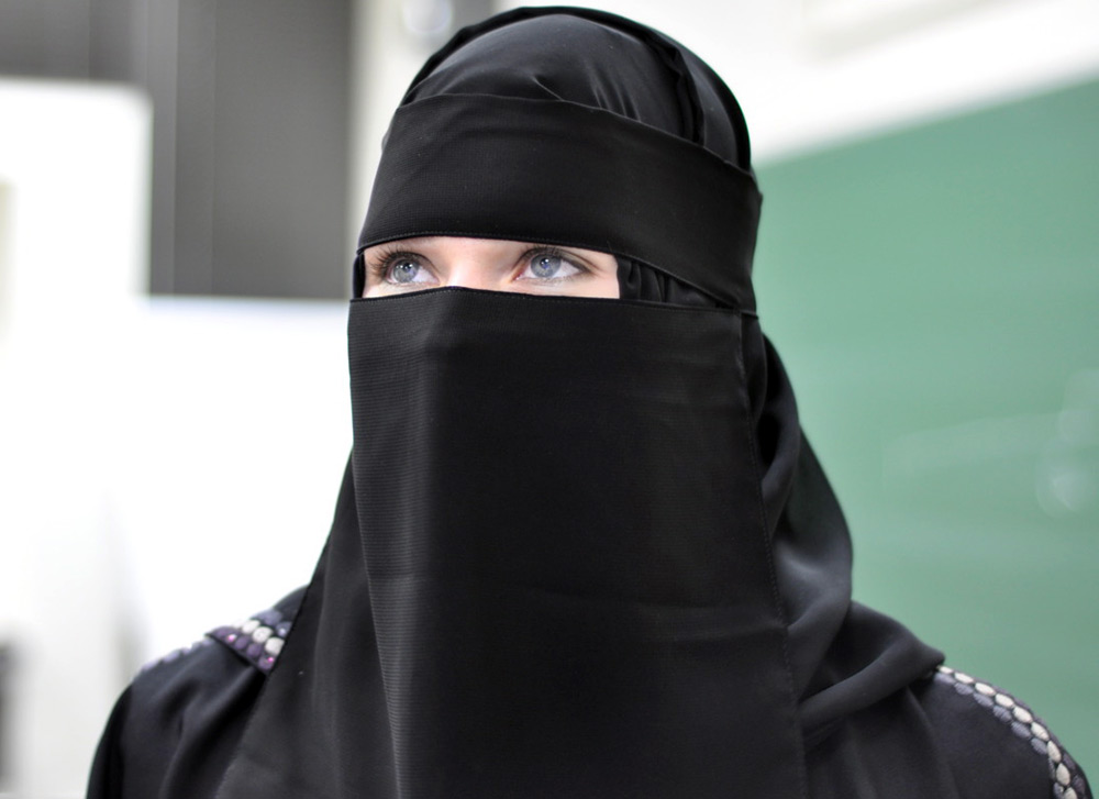 Girl in black niqab