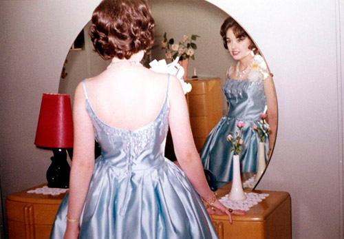 Vintage photos - girls decorate themselves in front of the mirror