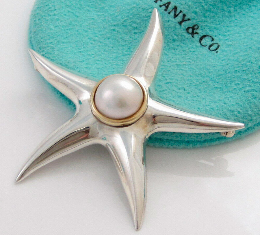 A brooch with pearls is a stylish and practical decoration